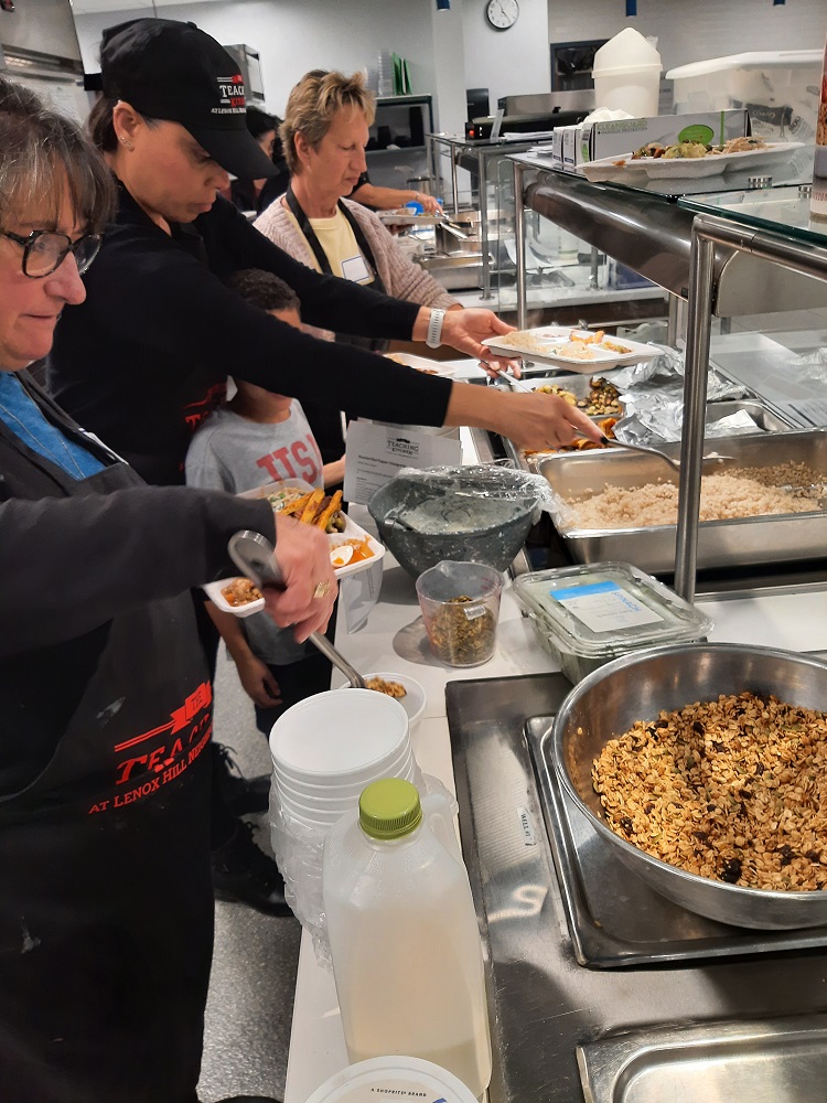 Food Services employees taste new recipes after a farm-to-school training, including items like handmade granola, barley, and roasted vegetables.