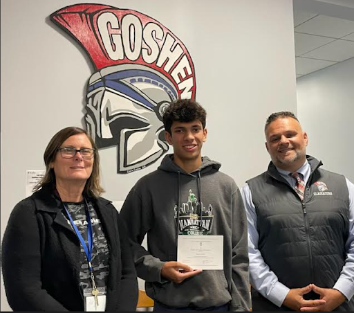 Kiran Foster stands with his Guidance Counselor, Laura Dubatowka and Principal, Nick Pantaleone with his award.