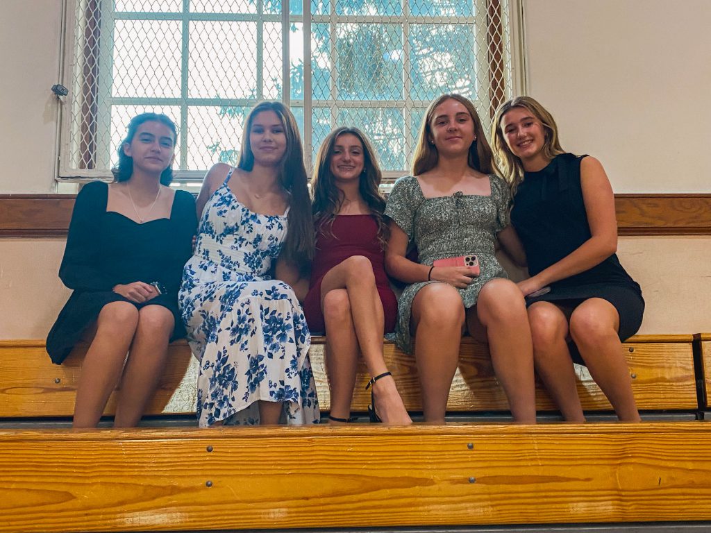 Five girls sitting together at the National Junior Honor Society in C.J. Hooker Middle School. 