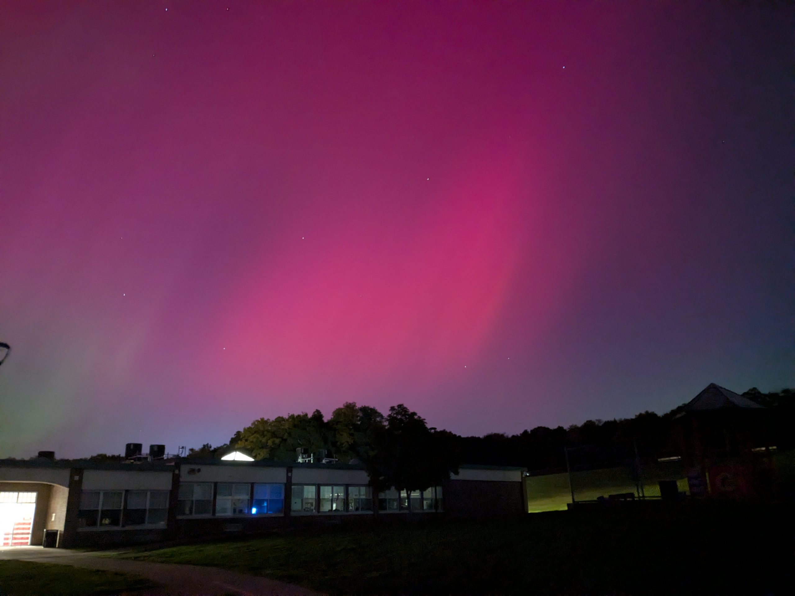 Rare aurora borealis dazzles night sky, astronomy club members