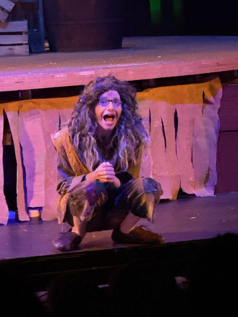 Dalton Fortugno-Harris is in character as Ben Gunn, the former member of Long John Silver's crew who was abandoned on Treasure Island, during a performance.