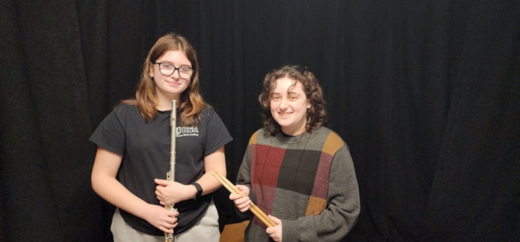 Two students from Goshen's All-County Orchestra pose for a photo. 