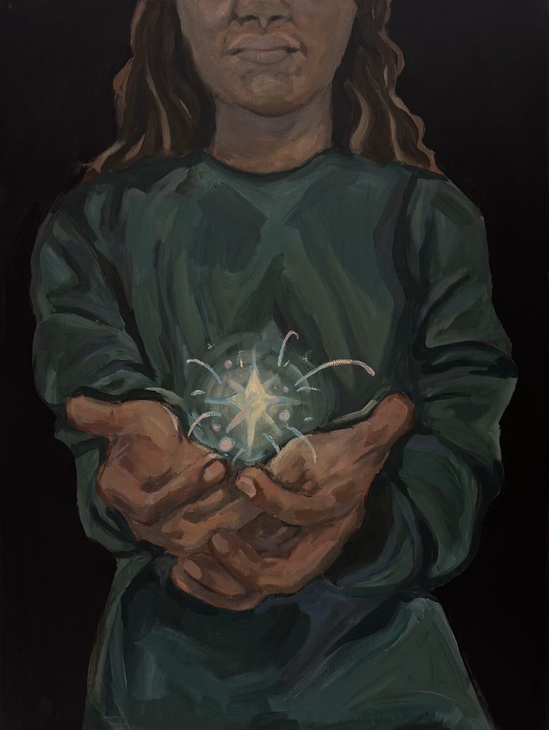 A girl holds a star cupped in her hands with black all around her. 